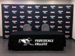 Custom media backdrop and hand-sewn table drape for Providence College