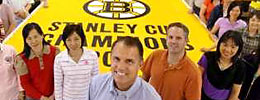 The crew with the new Boston Bruins Championship Banner