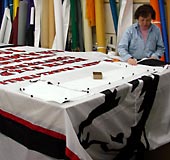Northern Illinois University banner being assembled.