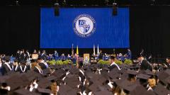 Giant applique school seal for Assumption College commencement