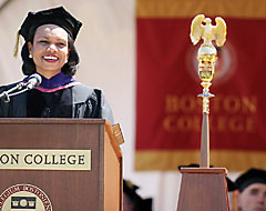 Condoleezza Rice speaking in front of Boston College custom logo banner