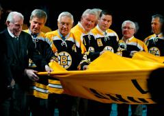 Custom Bruins 2011 championship banner carried by team veterans