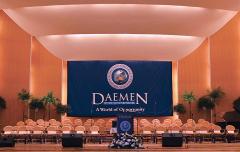 Large stage backdrop banner for commencement at Daemen