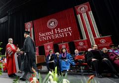 Giant applique commencement banners for Sacred Heart