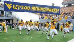 West Virginia custom football run under banner